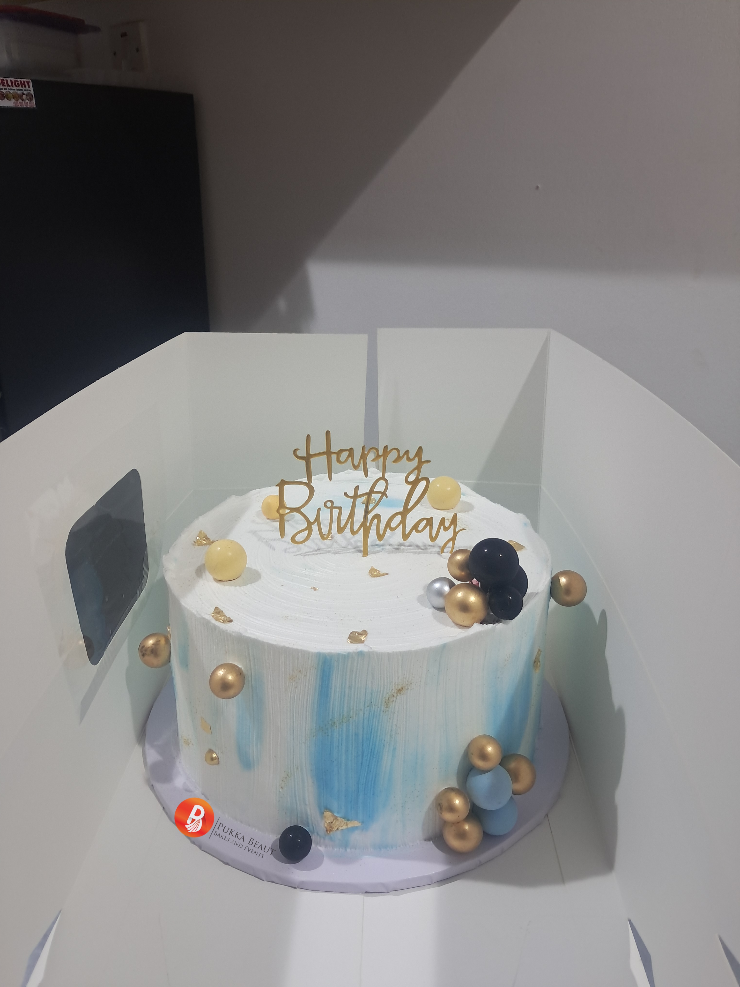 Gold and black chocolate sphere birthday cake by Pukka Beaut